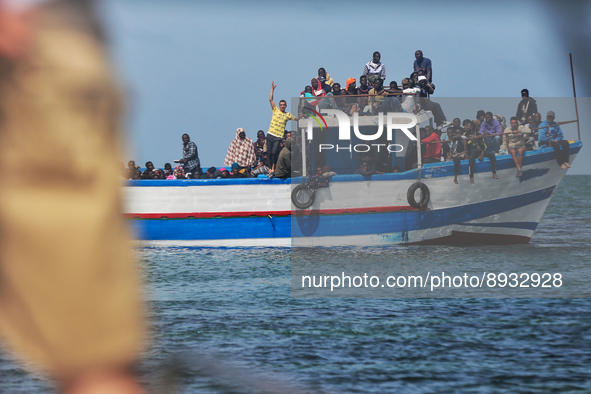 A small sailboat crowded with nearly 118 people 