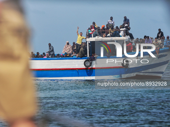 A small sailboat crowded with nearly 118 people (