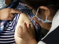 A person receives influenza vaccine during  the national influenza vaccination campaign at the Specialty Clinic. on October 3, 2022 in Mexic...