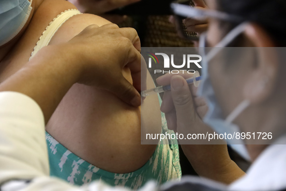 A person receives influenza vaccine during  the national influenza vaccination campaign at the Specialty Clinic. on October 3, 2022 in Mexic...