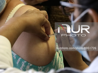 A person receives influenza vaccine during  the national influenza vaccination campaign at the Specialty Clinic. on October 3, 2022 in Mexic...