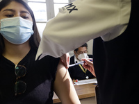 A person receives influenza vaccine during  the national influenza vaccination campaign at the Specialty Clinic. on October 3, 2022 in Mexic...