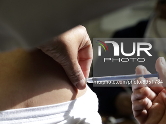 A person receives influenza vaccine during  the national influenza vaccination campaign at the Specialty Clinic. on October 3, 2022 in Mexic...