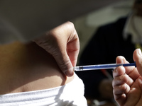 A person receives influenza vaccine during  the national influenza vaccination campaign at the Specialty Clinic. on October 3, 2022 in Mexic...