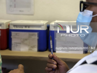 A person prepares a influenza vaccine during  the national influenza vaccination campaign at the Specialty Clinic. on October 3, 2022 in Mex...