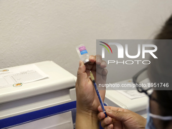 A person prepares a influenza vaccine during  the national influenza vaccination campaign at the Specialty Clinic. on October 3, 2022 in Mex...