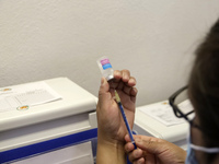 A person prepares a influenza vaccine during  the national influenza vaccination campaign at the Specialty Clinic. on October 3, 2022 in Mex...