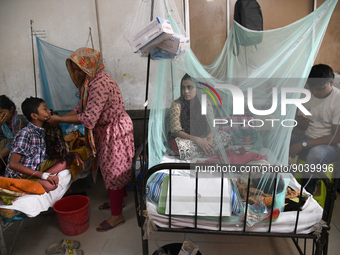 Children are kept inside mosquito nets as they are hospitalized due to dengue fever at Dhaka Child Hospital in Dhaka, Bangladesh on October...