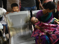 Parents gather in front of the emergency gate as they come to Dhaka child hospital for their Childs’s treatment in Dhaka, Bangladesh on Octo...