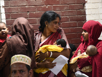 Parents gather in front of the emergency gate as they come to Dhaka child hospital for their Childs’s treatment in Dhaka, Bangladesh on Octo...