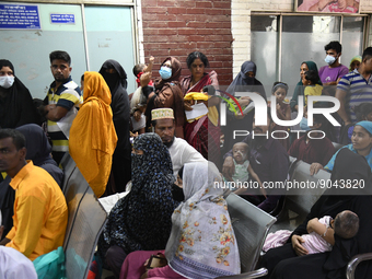 Parents gather in front of the emergency gate as they come to Dhaka child hospital for their Childs’s treatment in Dhaka, Bangladesh on Octo...