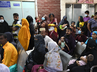 Parents gather in front of the emergency gate as they come to Dhaka child hospital for their Childs’s treatment in Dhaka, Bangladesh on Octo...