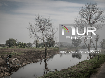 A dirty water canal at Dhapa waste duping ground, Kolkata, India. January 17, 2015. *** Go to http://nurphoto.com/en/reportages/51696 to see...