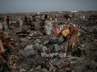 A female scavenger is picking waste. Dhapa waste dumping ground, Kolkata, India. January 20, 2015. *** Go to http://nurphoto.com/en/reportag...