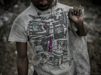 A waste picker found a plastic fluit and keeping that for himself. Dhapa waste dumping ground, Kolkata, India. January 17, 2015. *** Go to h...