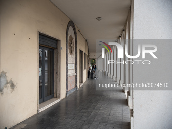 The portico in front of the church, on Piazza Italia, in Tresigallo, a town rebuilt during Fascism following a rationalist ideal. Tresigallo...