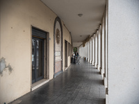 The portico in front of the church, on Piazza Italia, in Tresigallo, a town rebuilt during Fascism following a rationalist ideal. Tresigallo...