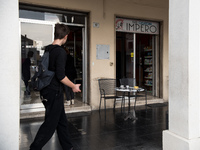 The portico in front of the church, on Piazza Italia, in Tresigallo, a town rebuilt during Fascism following a rationalist ideal. Tresigallo...