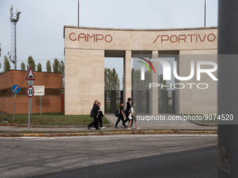 Sport field with monumental entrance and rationalist triumphal arch in Tresigallo, city rebuilt in the fascist era following a rationalist i...