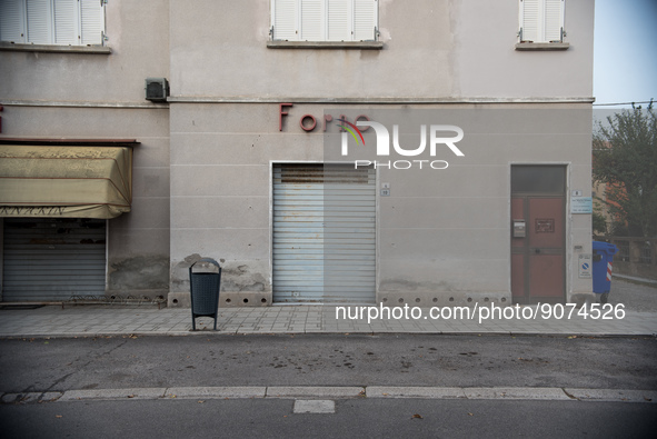 Building facing Viale Roma, one of Tresigallo's main streets, with the Forno (bakery) sign and the shutter down. In Tresigallo, in the provi...