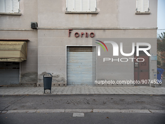 Building facing Viale Roma, one of Tresigallo's main streets, with the Forno (bakery) sign and the shutter down. In Tresigallo, in the provi...