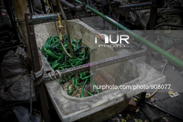 Plastic pipe factory at Dhapa, Kolkata, India. January 17, 2015.  *** Go to http://nurphoto.com/en/reportages/51754 to see more **** 