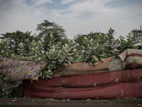 People have made boundary with old clothes. Dhapa, Kolkata, India. January 17, 2015.  *** Go to http://nurphoto.com/en/reportages/51754 to s...