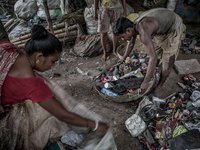 Workers are sorting out the wastes collected from the dumping ground. Dhapa, Kolkata, India. September 13, 2015.  *** Go to http://nurphoto....