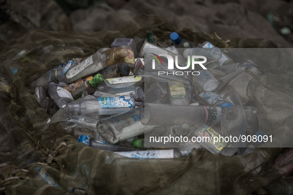 Waste bottles collected from the dumping ground. Dhapa, Kolkata, India. September 13, 2015.  *** Go to http://nurphoto.com/en/reportages/517...