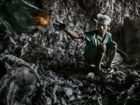 Worker at work beside Dhapa west dumping ground, Kolkata, India. January 17, 2015.  *** Go to http://nurphoto.com/en/reportages/51754 to see...