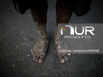 A worker who sorts out plastic in a plastic factory got his feet covered with plastics at Dhapa west dumping ground, Kolkata, India. January...