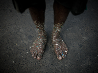 A worker who sorts out plastic in a plastic factory got his feet covered with plastics at Dhapa west dumping ground, Kolkata, India. January...