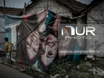 Kids are playing at Dhapa west dumping ground, Kolkata, India. January 17, 2015.  *** Go to http://nurphoto.com/en/reportages/51754 to see m...