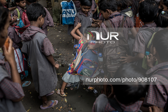 Kids are goning to school. Dhapa, Kolkata, India. September 11, 2015.  *** Go to http://nurphoto.com/en/reportages/51754 to see more **** 