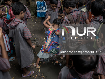 Kids are goning to school. Dhapa, Kolkata, India. September 11, 2015.  *** Go to http://nurphoto.com/en/reportages/51754 to see more **** (