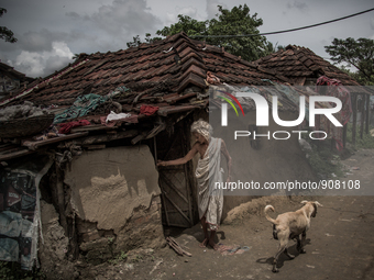 An old woman in front of her house at the village of Dhapa waste dumping ground. Dhapa, Kolkata, India. September 11, 2015.  *** Go to http:...