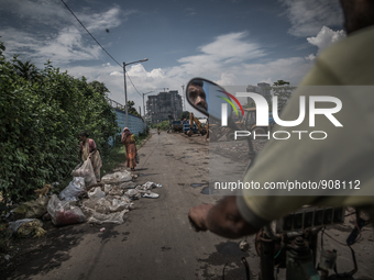 View of the city through the road of Dhapa waste dumping ground. Dhapa, Kolkata, India. September 14, 2015.  *** Go to http://nurphoto.com/e...