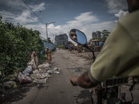 View of the city through the road of Dhapa waste dumping ground. Dhapa, Kolkata, India. September 14, 2015.  *** Go to http://nurphoto.com/e...