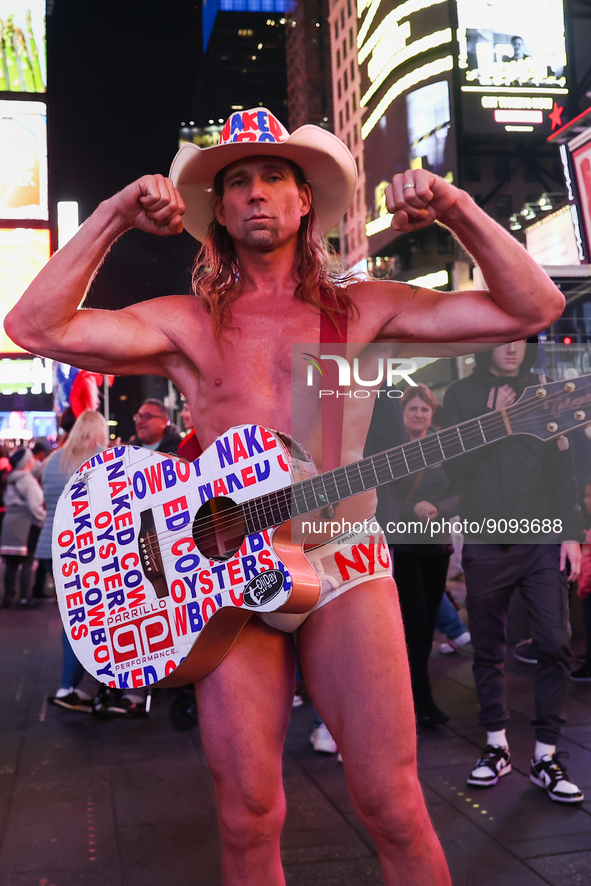 Robert John Burck, the Naked Cowboy, poses for a photo on Times Square in New York City, United States on October 22, 2022. 