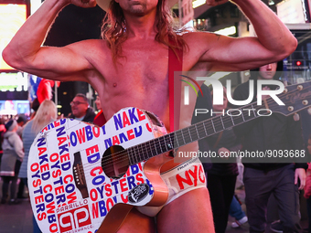 Robert John Burck, the Naked Cowboy, poses for a photo on Times Square in New York City, United States on October 22, 2022. (