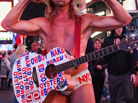 Robert John Burck, the Naked Cowboy, poses for a photo on Times Square in New York City, United States on October 22, 2022. (