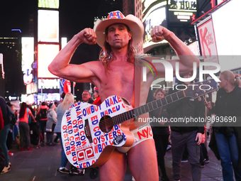 Robert John Burck, the Naked Cowboy, poses for a photo on Times Square in New York City, United States on October 22, 2022. (