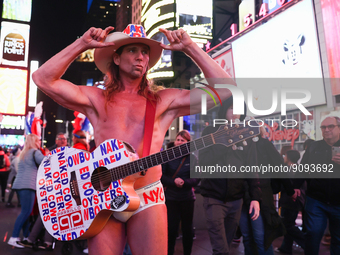 Robert John Burck, the Naked Cowboy, poses for a photo on Times Square in New York City, United States on October 22, 2022. (