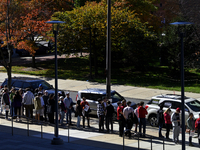 People wait in line ahead of a neighborhood rally with PA Lt Gov. John Fetterman at Temple University in North Philadelphia, PA, USA on Octo...