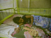 Bangladeshi child dengue patients covered with a mosquito net suffers from dengue fever as they receive treatment inside the Dhaka Child Hos...