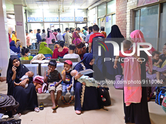 Relatives gather with their child patients in front of the emergency gate as they come to Dhaka child hospital for treatment in Dhaka, Bangl...