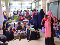 Relatives gather with their child patients in front of the emergency gate as they come to Dhaka child hospital for treatment in Dhaka, Bangl...