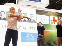 Heike Henkel, an Olympic champion, teaches exercise during the opening day of Medica 2022, a medical technology and health care exhibition i...