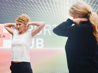 Heike Henkel, an Olympic champion, teaches exercise during the opening day of Medica 2022, a medical technology and health care exhibition i...