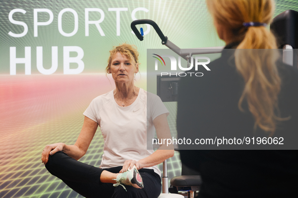 Heike Henkel, an Olympic champion, teaches exercise during the opening day of Medica 2022, a medical technology and health care exhibition i...